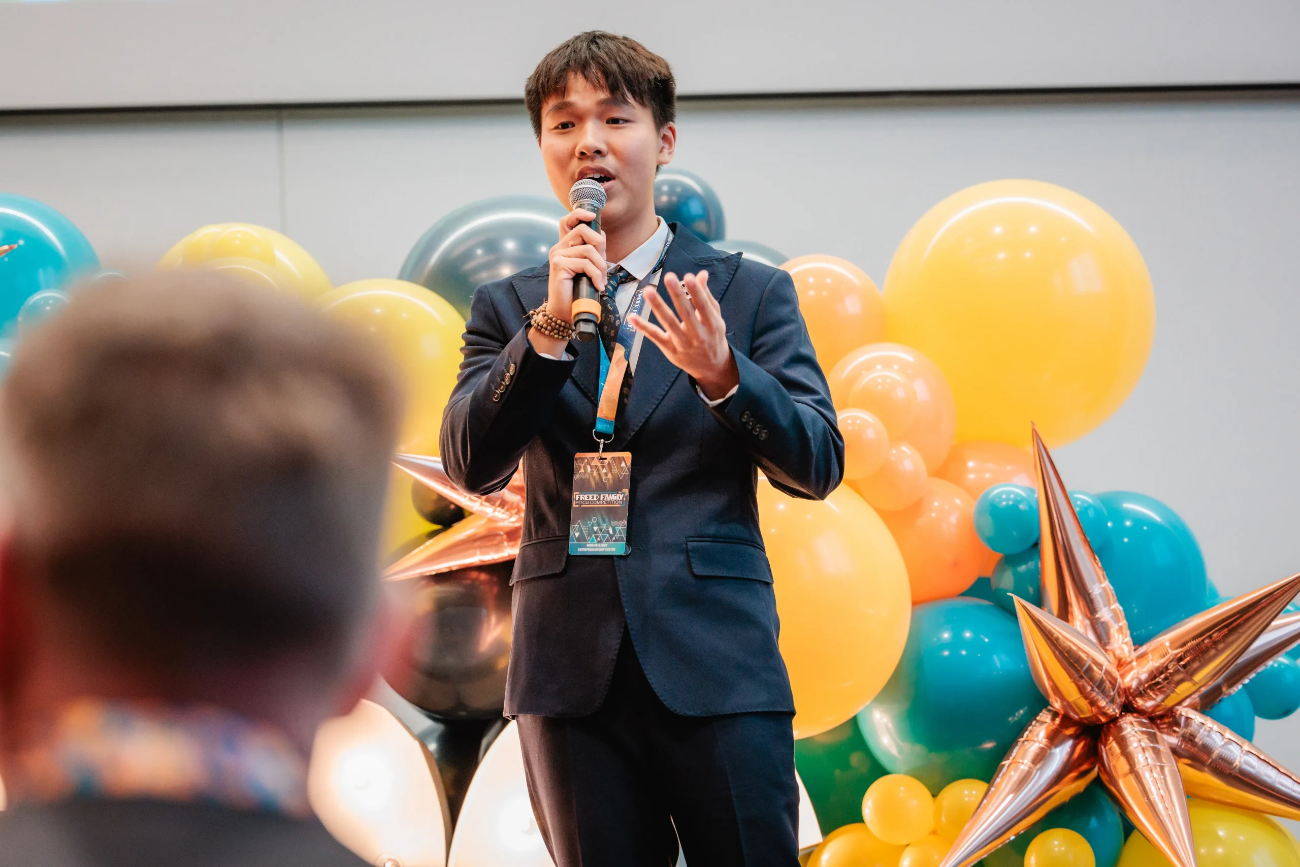 Pictured: Hieu (Johnny) Tran pitching in the Herb Kelleher Entrepreneurship Center’s 2024 Freed Family Pitch Competition Fina